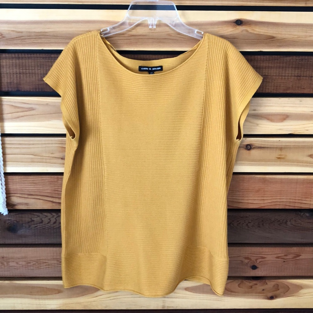Cable and gauge mustard yellow shirt.